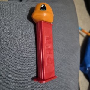 Pez D'Or Orange and Red Action Figure Dispenser